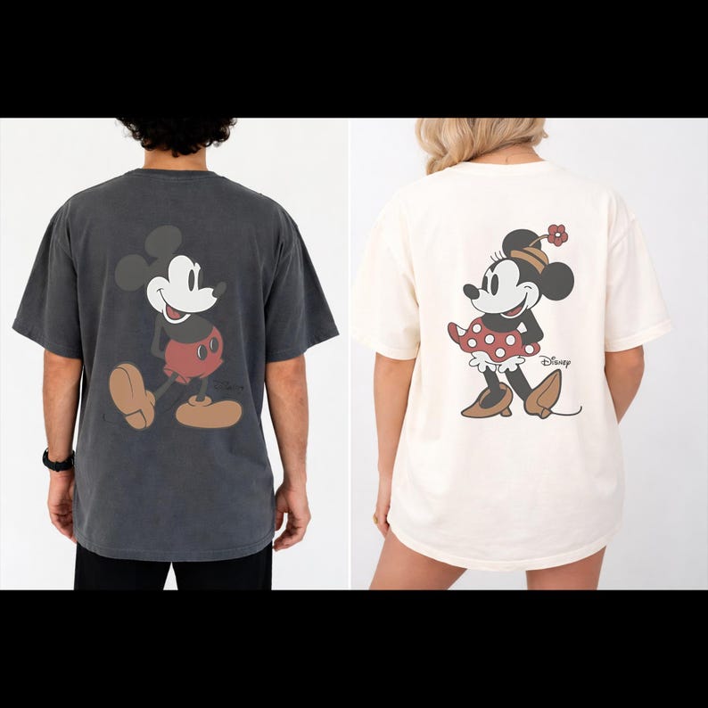 May include: Two t-shirts featuring Disney characters. One is dark gray with Mickey Mouse, the other is cream-colored with Minnie Mouse. Both shirts have the characters printed on the back. The Minnie Mouse shirt has the Disney logo.