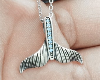 Sterling Silver Whale Tail Necklace: Blue Zircon Birthstone Pendant