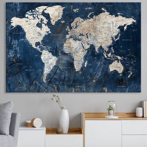 Large 3-panel Blue World Map Canvas Print with detailed continents, framed wall art perfect for living rooms, offices, and travel enthusiasts. Ready to hang for easy setup.