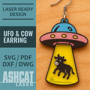 May include: Laser cut wooden earring featuring a pink and blue UFO with a yellow beam of light abducting a black cow. The earring is ready to be assembled and includes a silver hook.