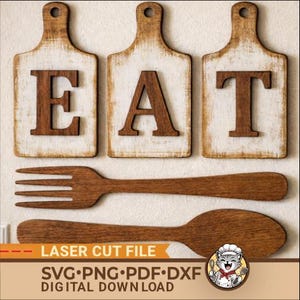 May include: Wooden kitchen decor set with three white-painted cutting boards spelling "EAT" with brown letters. A wooden fork and spoon are below. The image also includes the text "LASER CUT FILE" and "SVG•PNG•PDF•DXF DIGITAL DOWNLOAD".