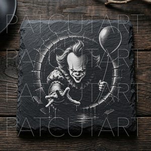 May include: A square black slate coaster featuring a white engraved illustration of a clown with a ruffled collar emerging from a circular brick drain. The clown holds a single balloon in one hand and reaches forward with the other hand.
