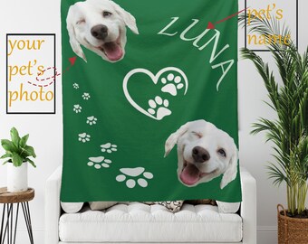 May include: Green fleece blanket with a white heart and paw prints. The blanket has two white dog faces with the name "LUNA" printed on it.