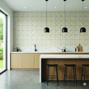 May include: A modern kitchen with light wood cabinetry, a marble countertop, and a patterned tile backsplash. Three black pendant lights hang above a marble island with black stools. A large window offers a view of the outdoors.