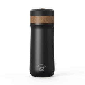 May include: A black stainless steel travel mug with a wood-grain accent around the lid. The mug has a logo that says "The Drinkware Co."