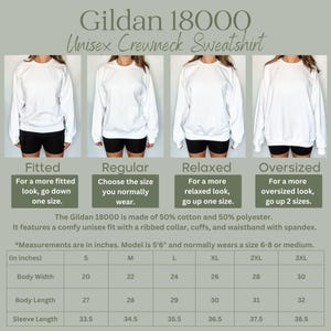 May include: White Gildan 18000 unisex crewneck sweatshirt. The image shows four models wearing the sweatshirt in different fits: fitted, regular, relaxed, and oversized. Measurements are provided in inches for body width, length, and sleeve length.