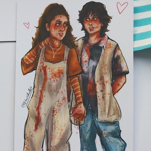 May include: A digital illustration of two people, a woman and a man, standing side by side. The woman is wearing a white jumpsuit with orange stripes and the man is wearing a blue and white patterned shirt with a brown vest. Both are covered in red splatters, suggesting blood. The image is captioned "@thewildwidow".