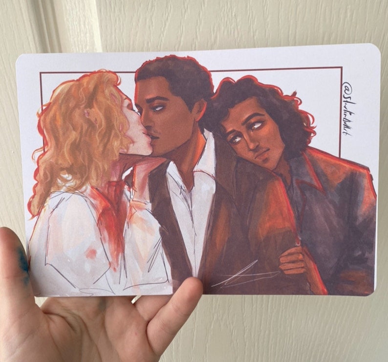 May include: A watercolor illustration of three people. The person on the left has long blonde hair and is wearing a white shirt. The person in the middle has short black hair and is wearing a white shirt and a dark jacket. The person on the right has long dark hair and is wearing a dark jacket. The person in the middle is kissing the person on the left. The illustration is signed "@Sh-t-addlt".