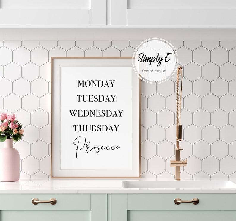 May include: A framed print with the text "Monday, Tuesday, Wednesday, Thursday, Prosecco" in black lettering on a white background.
