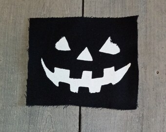 Parche de caras de calabaza