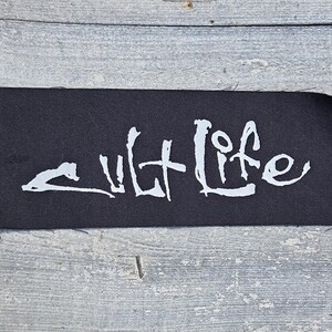 Sew on Patch ,Hand-Cut Black Fabric Patch: Cult Life Design (7.5" x 3")