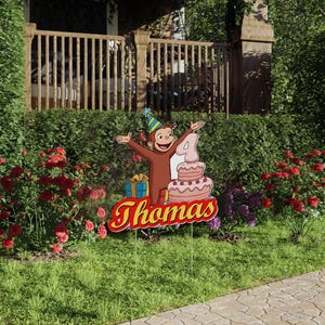 May include: A colorful birthday yard sign featuring a cartoon monkey wearing a party hat, holding a pink and white cake with a number 4 on top. The sign also includes the name "Thomas" in red and yellow letters.