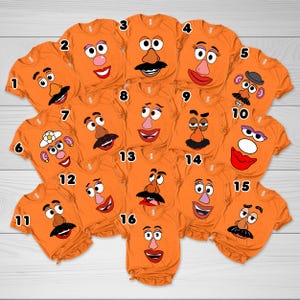 May include: Sixteen orange t-shirts with various Mr. Potato Head face designs. Each shirt features a different expression, including mustaches, smiles, and eye shapes. The shirts are arranged in a grid pattern on a light wood surface.