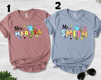 Personalized Teacher Name Shirt,Library Storybook Kindergarten Shirt,Children's Book Characters Shirt,Reading Day Shirt, Read Across NFYM07