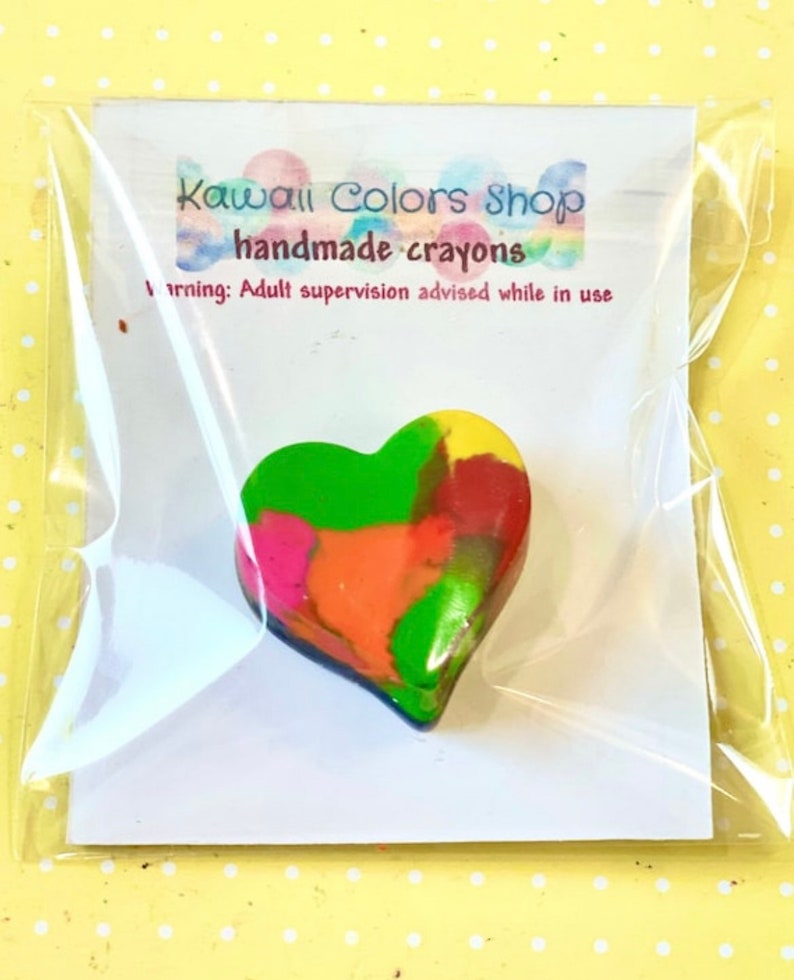 Heart crayon in multiple colors and customized message card is individually wrapped in a clear cellophane bag