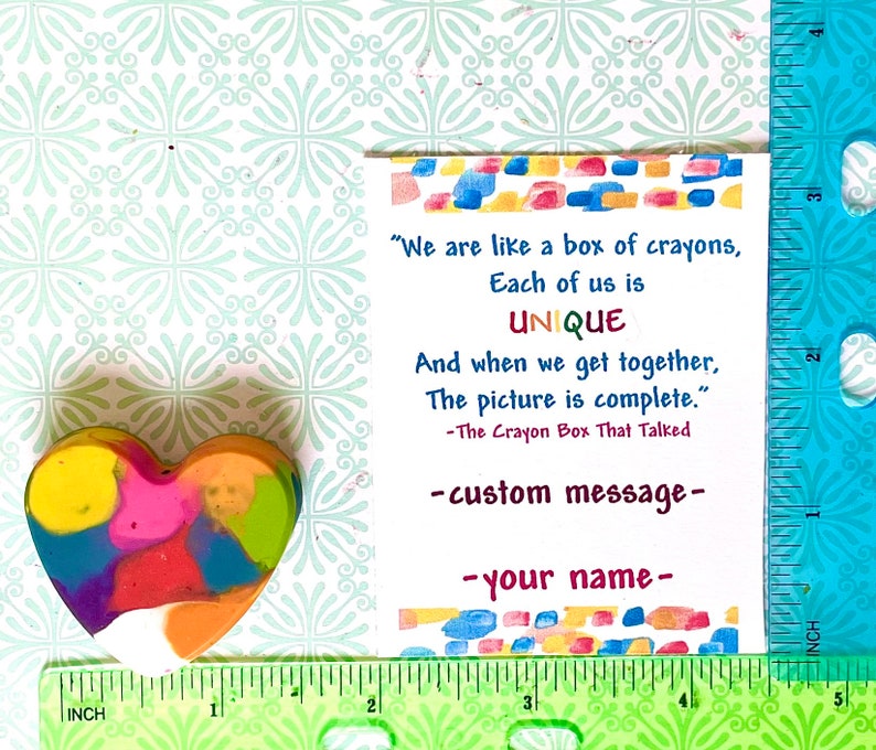 Heart crayon in multiple colors measures 1 inch wide by 1.5 inches long.  Customized card measures 2.5 inches wide and 3 inches long