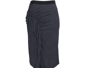 May include: A dark gray skirt with a ruffled detail on the side.