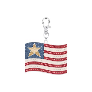 May include: A silver key chain with a red, white, and blue American flag charm. The flag has a gold star in the blue canton.