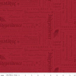 May include: Red fabric with patriotic text including "Independence", "Freedom", and "Justice". The design features phrases and dates related to the United States of America, with a repeating pattern of words and phrases.