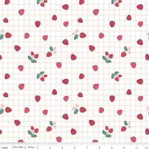 May include: A white fabric with a repeating pattern of red strawberries, green leaves, and small white flowers. The design is set against a grid of light pink lines, creating a playful and fresh aesthetic. The fabric is suitable for various crafting projects.