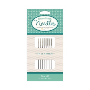 May include: A package of cross-stitch needles. The package is primarily white and teal, with the words "Cross-Stitch Needles" in a decorative font. The package contains a set of 8 needles, size #28, measuring 32.65mm x 0.50mm.