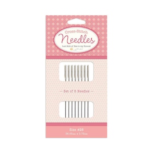 May include: A pink and white packaging card with a set of 8 cross-stitch needles. The card says "Cross-Stitch Needles" and "Lori Holt of Bee in my Bonnet". The needles are size #26, 36.85mm x 0.76mm.