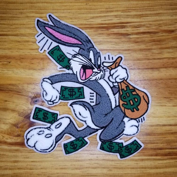 7x6.25 Chenille Bugs Bunny running with a bag of money Iron-On Patch is a beauty