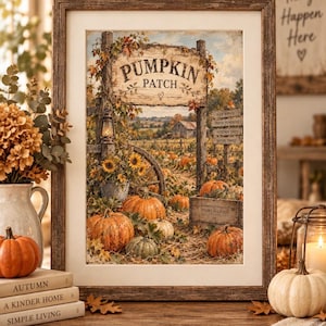 May include: A framed wall art print depicting a pumpkin patch scene with a wooden sign reading PUMPKIN PATCH, sunflowers, a lantern, and a wooden crate labeled STORY & GRAIN. The artwork features orange pumpkins, autumn foliage, and a rural landscape.