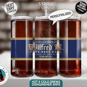 May include: Personalized 20 ounce stainless steel tumbler with a Johnnie Walker label featuring the text "U Jilfred JR. The Best Dad" and a gold and blue color scheme. The tumbler is dishwasher safe and includes a straw.