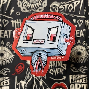 May include: A red and gray robot sticker with angry eyes and a red wire on its head. The robot is labeled "Starr Syndicate" and has the text "Taking Over" below it.