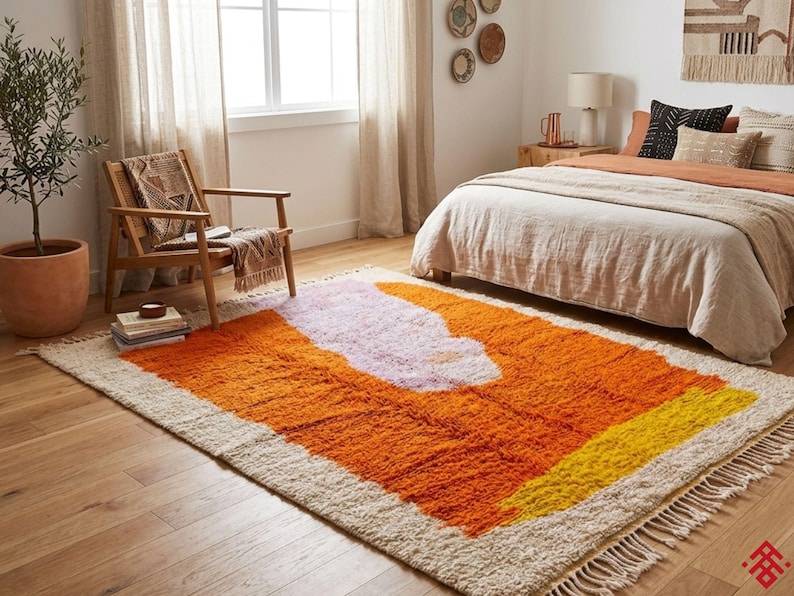 Vibrant orange Moroccan area rug with high pile wool texture styled in a mid century modern interior