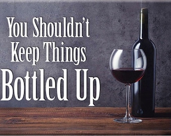 May include: A gray background with the text "You Shouldn't Keep Things Bottled Up" in white. A glass of red wine and a bottle of red wine are on a wooden surface.