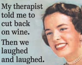 May include: A woman smiles while holding a glass of red wine. The text reads "My therapist told me to cut back on wine. Then we laughed and laughed."