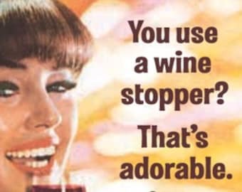 May include: A woman with brown hair and a red lipstick smiles while holding a glass of red wine. The text in the image reads "You use a wine stopper? That's adorable."