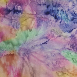 May include: Abstract fabric with a tie-dye pattern in shades of pink, purple, blue, green, and yellow. The fabric has a textured appearance, with the colors blending and swirling together. The design is reminiscent of watercolor or batik.