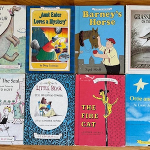 May include: A collection of ten children's books with colorful covers featuring illustrations of a dinosaur, a bear, a cat, a grasshopper, a seal, a star, a horse, and a mystery. The books are all part of the "I Can Read Book" series.