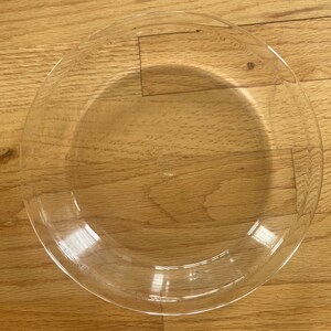 May include: A clear glass pie plate, perfect for baking delicious pies and tarts.
