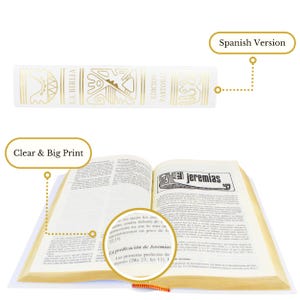 May include: An open Spanish language Bible with gold lettering on the spine. The spine reads "La Biblia" and "Edicion Pastora". The open pages show the book of Jeremiah with the text "La predicaci&oacute;n de Jeremias" and "Las primeras profecias de Jeremias (2Re 23, Jer 13, 11)".