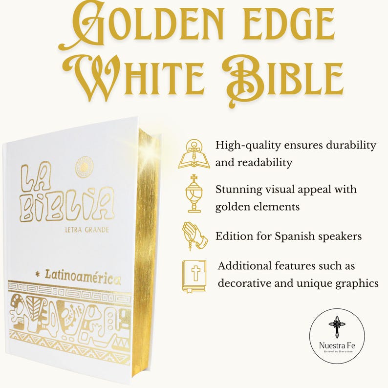 May include: A white hardcover Bible with gold accents and the title "La Biblia" in gold lettering. The book has a gold edge and features decorative gold designs. The text "Nuestra Fe" is also visible in gold lettering.