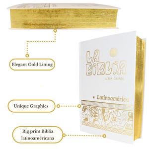 May include: White hardcover book with gold lettering and decorative accents. The title is "La Biblia" with the words "Letra Grande" and "Latinoam&eacute;rica" printed below. The book has a gold-lined edge.
