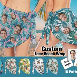 May include: Two people wearing custom face beach wraps with tropical leaf patterns. The wraps are available in 16 different patterns.  The text "Custom Face Beach Wrap" and "Any Logo" are visible in the image.