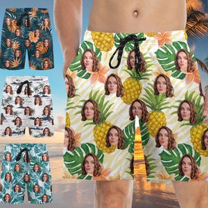 May include: Four pairs of colorful patterned swim trunks with different designs. Each pair features a tropical theme with various colors and patterns. The trunks are made of a lightweight fabric and have an elastic waistband.