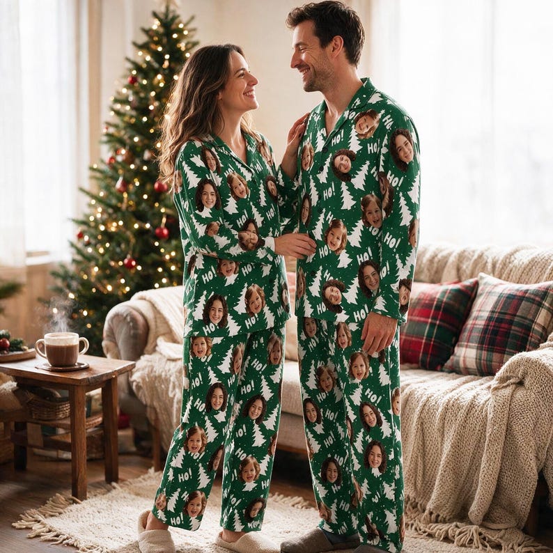 May include: Matching green pyjama sets featuring a repeating pattern of white Christmas trees, the text "Ho!", and custom printed faces. Each set consists of a long-sleeved button-down shirt with a collar and matching long trousers with an elastic waist.