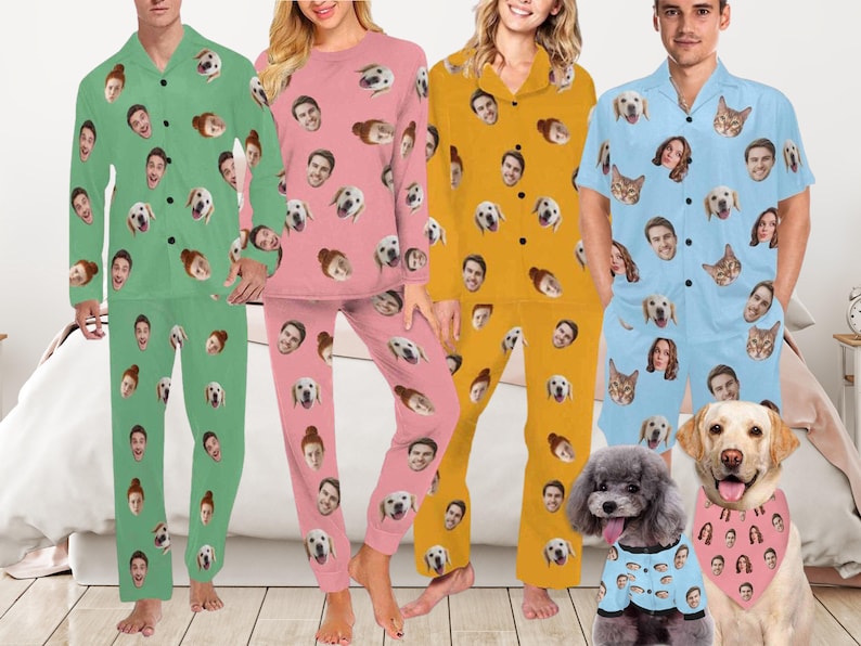 May include: Four sets of pyjamas in green, pink, yellow, and light blue, each featuring a repeating pattern of human and dog faces. The light blue set includes short sleeves and shorts, while the others have long sleeves and trousers. A dog wears a matching bandana.