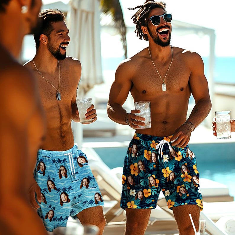 May include: Two pairs of swim shorts featuring custom photo prints. One pair is light blue with a palm tree pattern, and the other is dark blue with yellow hibiscus flowers. Both pairs have white drawstring waistbands and a repeating face print.
