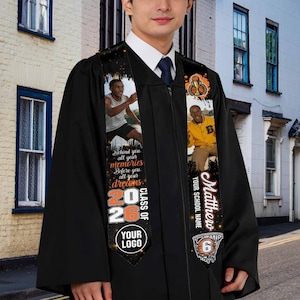 May include: Black graduation gown with custom sash. The sash features photos, the text "Behind you all your memories, Before you all your dreams", "Class of 2026", and a basketball graphic. The sash also includes the name "Matthew" and the number "6".