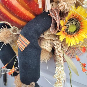 close up of a leg and sunflower