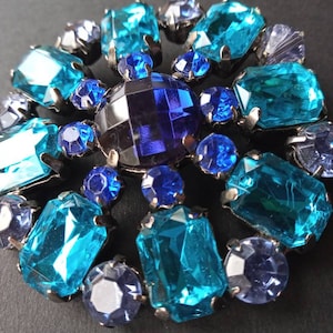 Plastic fantastic blue stone brooch