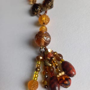 Unique beaded necklace in yellows and browns (with turtles!)