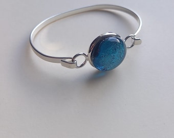 Silver bangle bracelet with blue stone